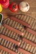 hotdogs on metal grill