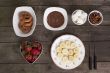 chocolates fruits and biscuits on the wooden table