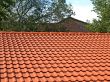  roof is covered with red tiles