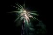 a mix of blue green and yellow fireworks