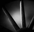 black and white image of a wheel spokes