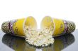 two cups of spilled popcorn