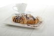 chocolate flavor croissant with coffee on the side