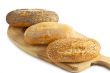 three breads on the wooden plank