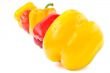 Multi-colored peppers on a white background