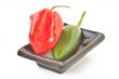 Multi-colored peppers on a white background