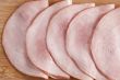 slices of uncooked ham on the plate