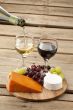 view of cheese with grapes and wine