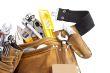 tool belt with work tools on white background