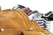 spanners in brown tool belt