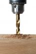 drilling a piece of wood plank