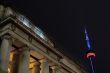 low angle shot of building with pillar with cn tower in background