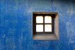 close up shot of a wall and a old window