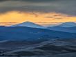 scenic sunset shot with valley and mountain range