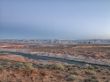 mountain range and river with clear sky in background