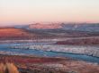 mountain range and water stream with clear sky in background