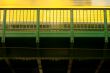 Tram passes bridge