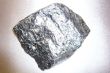 Silvery shiny stone on gray background