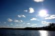 Sky, sun and water of lake.