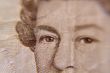 Closeup of Queen Elizabeth, on a british five pound note