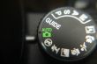 Macro image of a digital camera`s controls set on auto