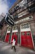 Woman walks past Massey Hall