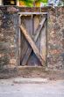 Wood Door Embedded in Stone