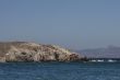 cliff with sea in foreground delos greece