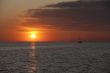 watercraft in sea at sunset