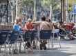 men and women at outdoors restaurant in barcelona spain