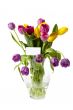 colorful tulips in vase with a card