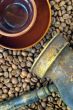 Coffee pot, cup and coffee beans close-up