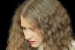 Young woman with long brown nature hair