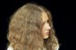 Young woman with long brown nature hair