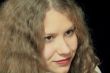 Young woman with long brown nature hair