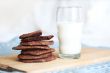 a glass of milk and chocolate cookies
