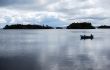 Two men in a boat in bay