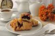 Morning cup of coffee and freshly baked cakes with cherries