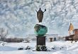 Religious sculpture - man in the mantle on the globe