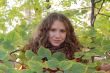 Young woman with autumn leaves