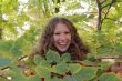 Young woman with autumn leaves
