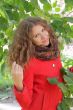 Beautiful young woman in red coat