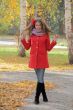 Beautiful young woman in red coat