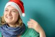Laughing young Woman with Santa Hat