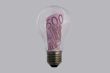 The concepts of money and energy are encased in a light bulb