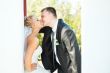 Bride and groom posing on a white background
