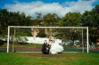Bride and groom on the football field