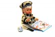 The doll is holding an open book. 