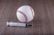 Baseball and syringe