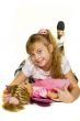 Beautiful little girl playing with a doll.